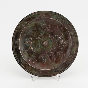A Chinese bronze mirror, presumably Ming dynasty (1368-1644).