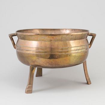 A Swedish 18th/19th century brass pot on three legs.