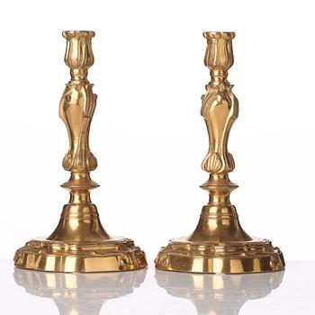 A pair of French Louis XV 18th century gilt bronze candlesticks.
