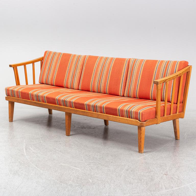 A Swedish 1960s Carl Malmsten pine wood sofa.