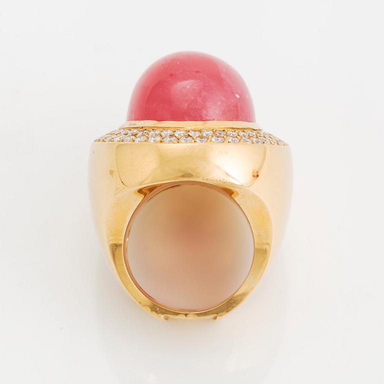 An 18K gold and rhodochrosite Acchinelli ring set with round brilliant-cut diamonds.