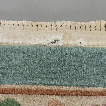 An old Chinese carpet ca 335 x 243 cm.