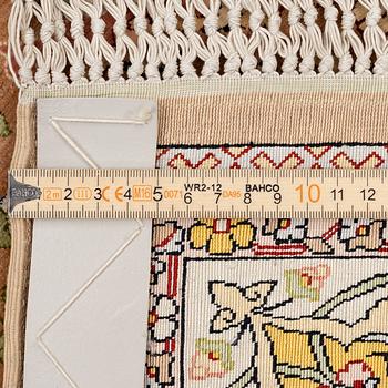 A semi-antique Hereke souf, silk and metal thread rug, West Anatolia, c. 163 x 103 cm.