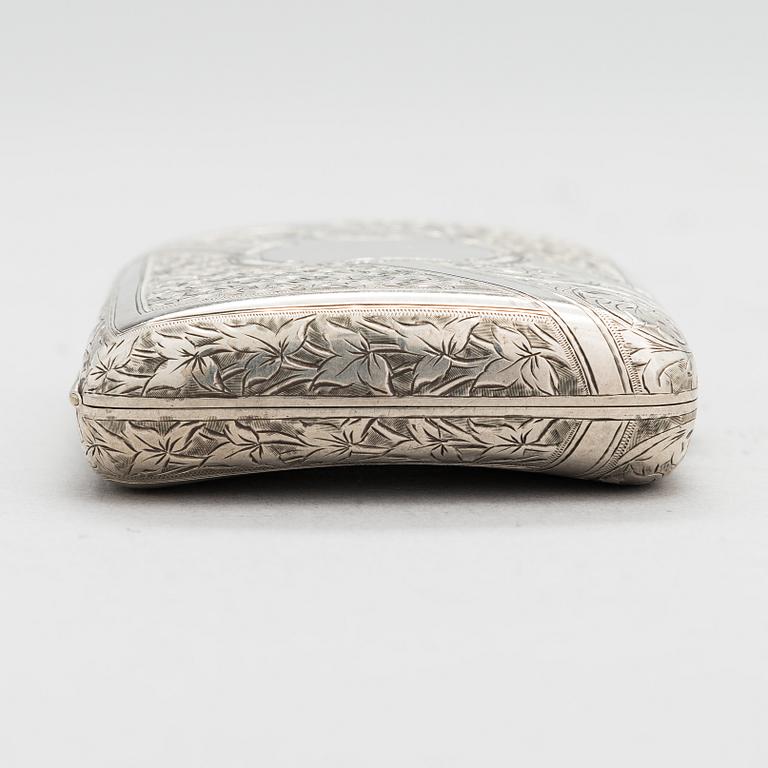 An English sterling silver cigarette case, maker's mark William M. Hayes, of Birmingham, 1896.
