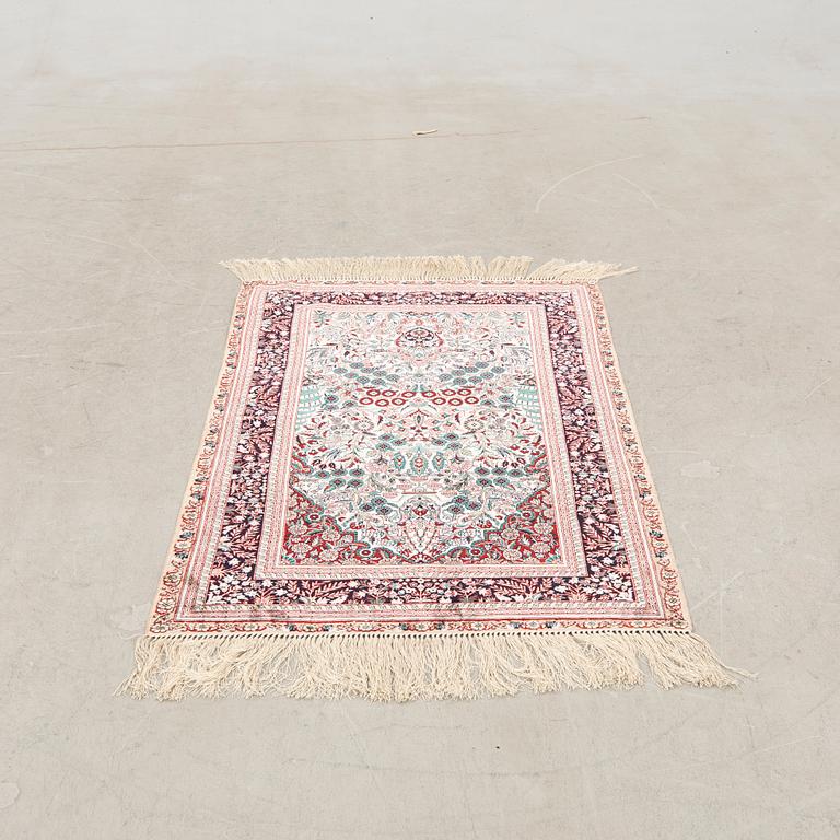 Oriental silk rug, approximately 121x77 cm.