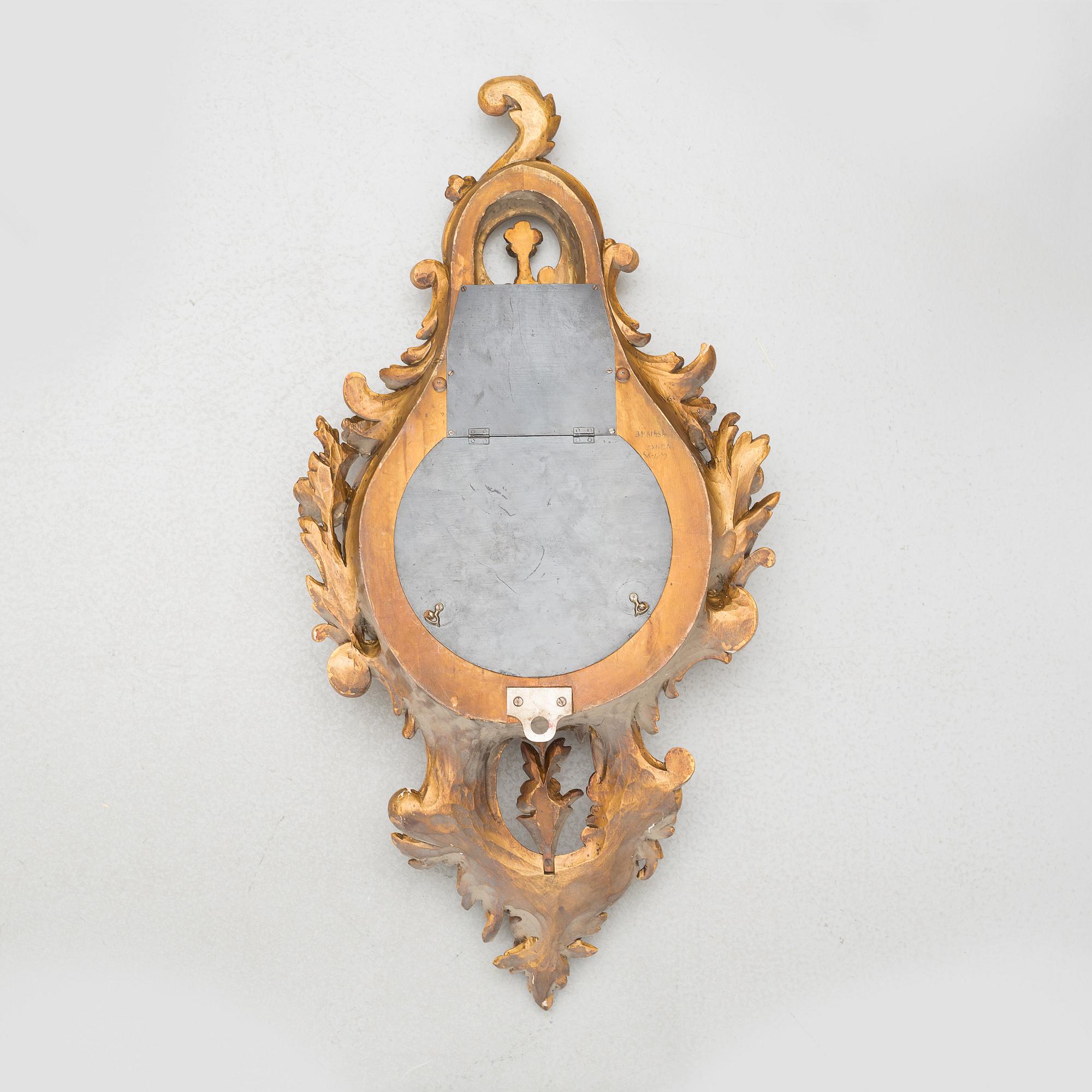 A rococo style wall clock, first half of the 20th century.