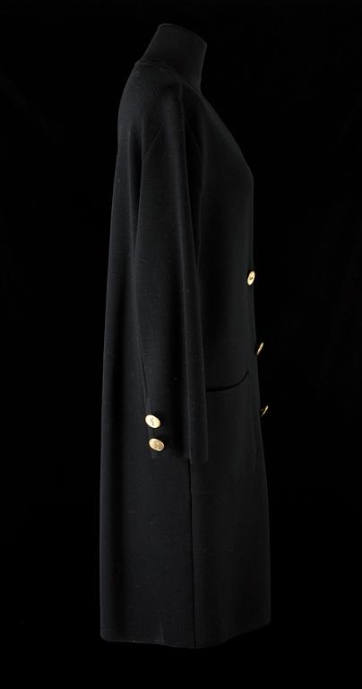 A 1970s black knitted wool coat dress by Yves Saint Laurent.