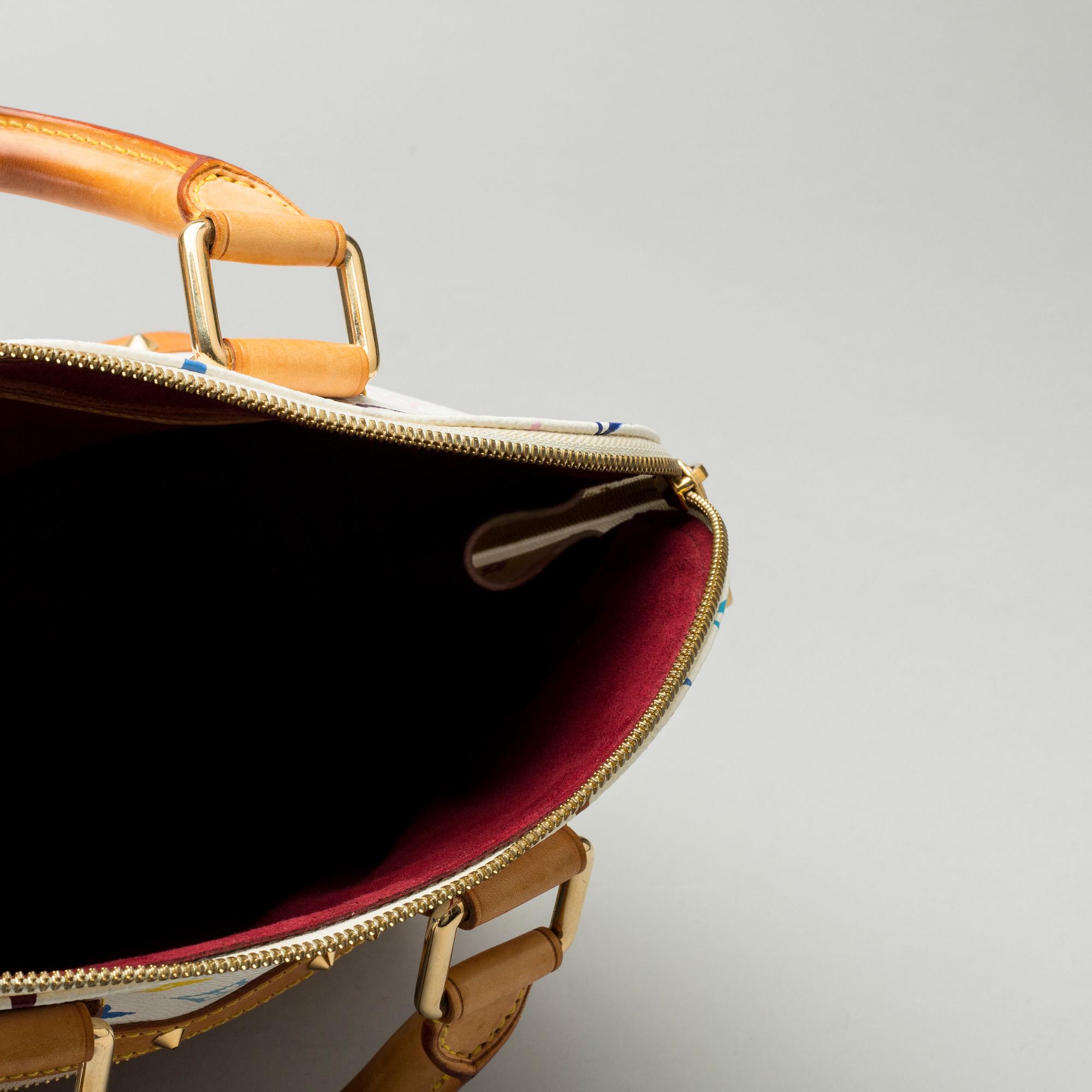 A LOUIS VUITTON ALMA BAG.