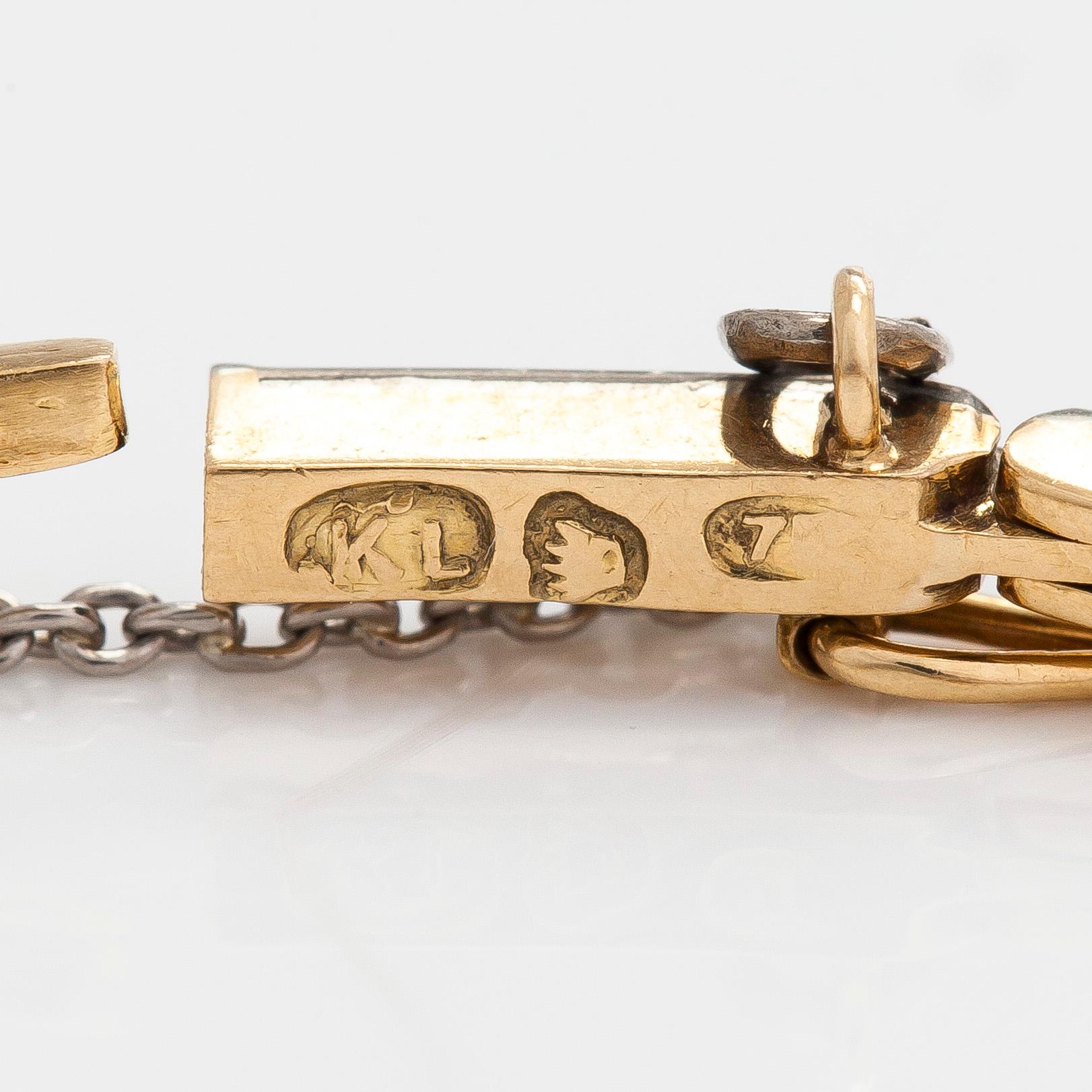 Rannekoru, 18K kultaa timantteja yhteensä noin 0.50 ct. Suomalaiset leimat.
