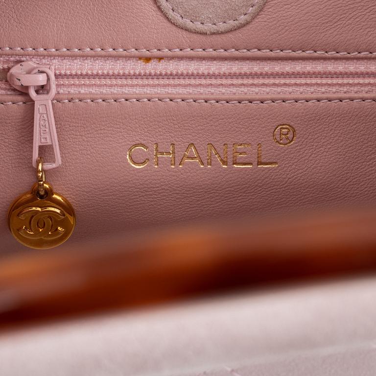 Chanel, a pink suede "Sac shopping" bag, 1997-1999.