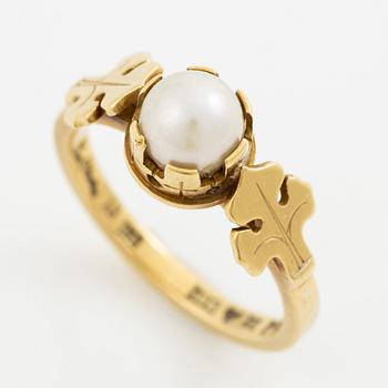Wiwen Nilsson, a ring 18K gold with a pearl and two motifs of the french lily, Lund 1951.
