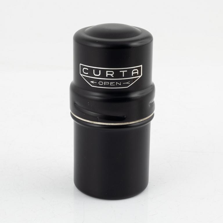 A Curta Type I mechanical calculator.