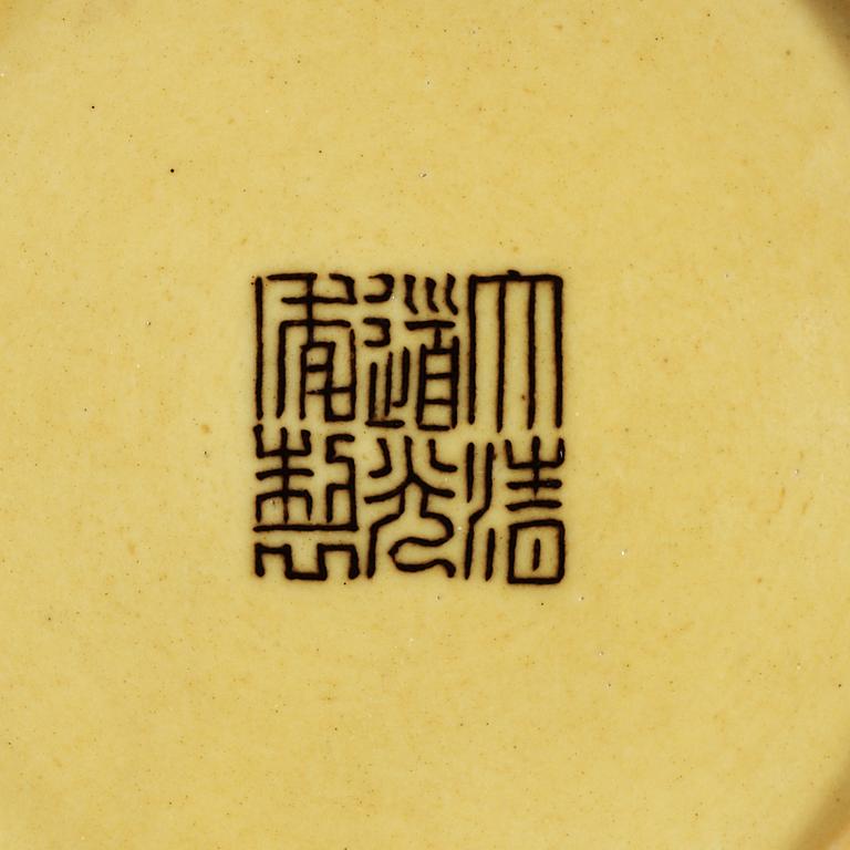 Two yellow ground dishes, Qing dynasty with Jiaqing sealmark (1796-1820) and Daoguangs sealmark and period (1821-1850).