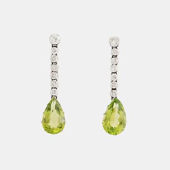 489. A pair of 18K white gold earrings set with faceted peridots and round brilliant-cut diamonds.