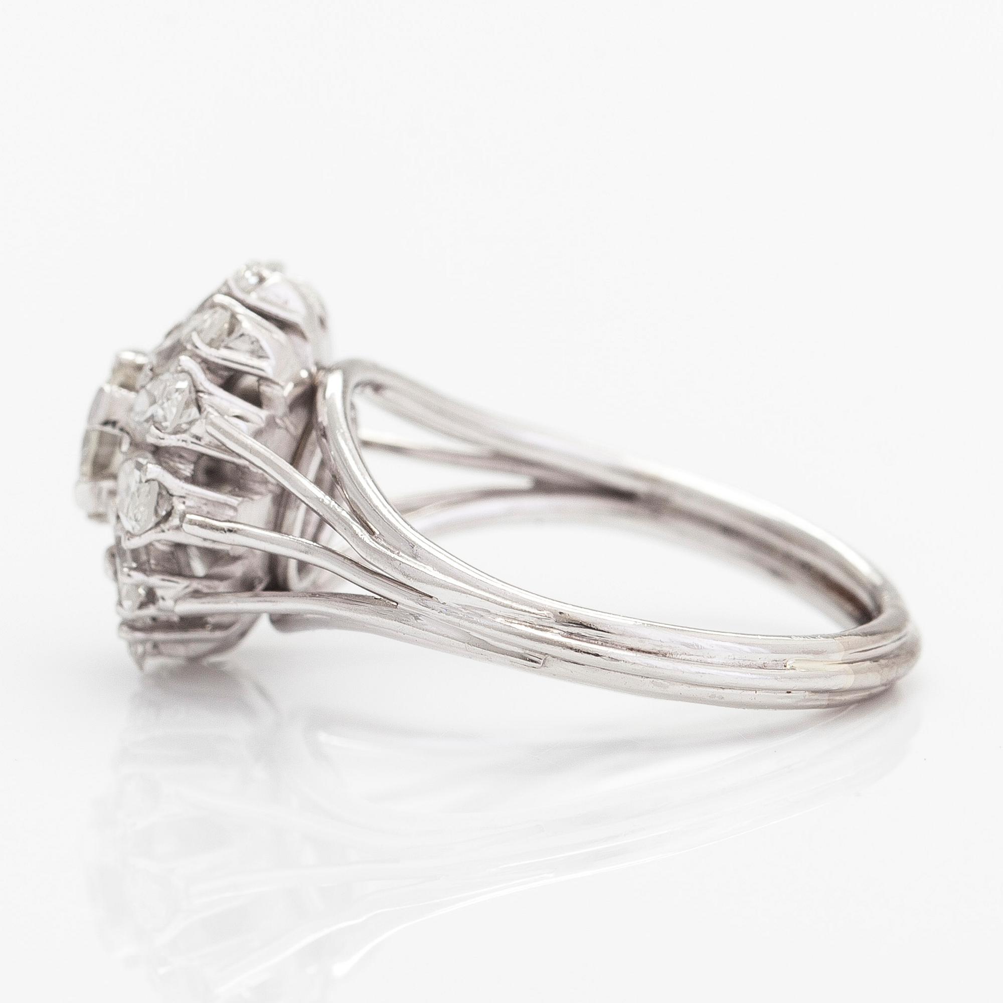 A platinum ring, with brilliant- and marquise cut diamonds totalling approximately 1.74 ct.