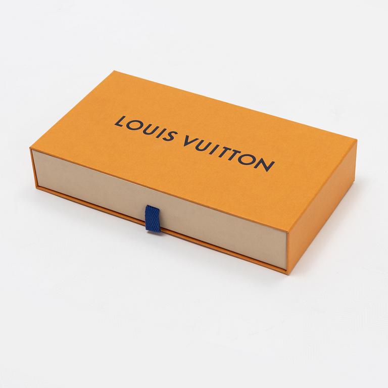Louis Vuitton, a silk scarf.
