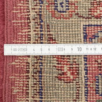 An oriental/eastern European carpet, c. 355 x 275 cm.