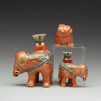 A group of Canton famille rose candle sticks, late Qing dynasty, early 20th Century.