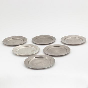 A set of six pewter plates from Firma Svenskt Tenn, including Stockholm 1968.