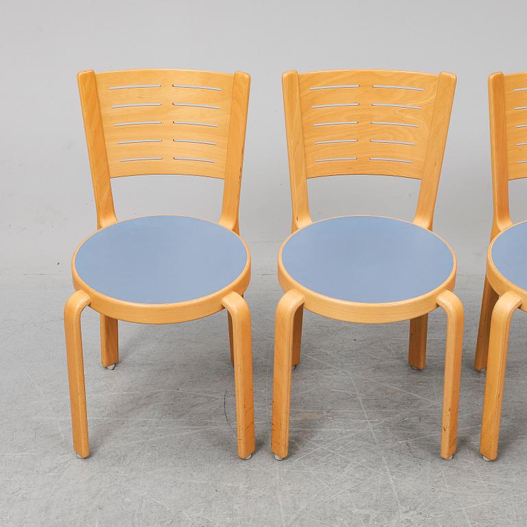 Table with four chairs, late 20th Century by Magnus Olesen.