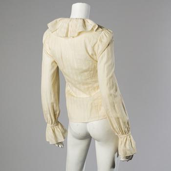 A wool/alpaca jacket by Ralph Lauren and two blouses.