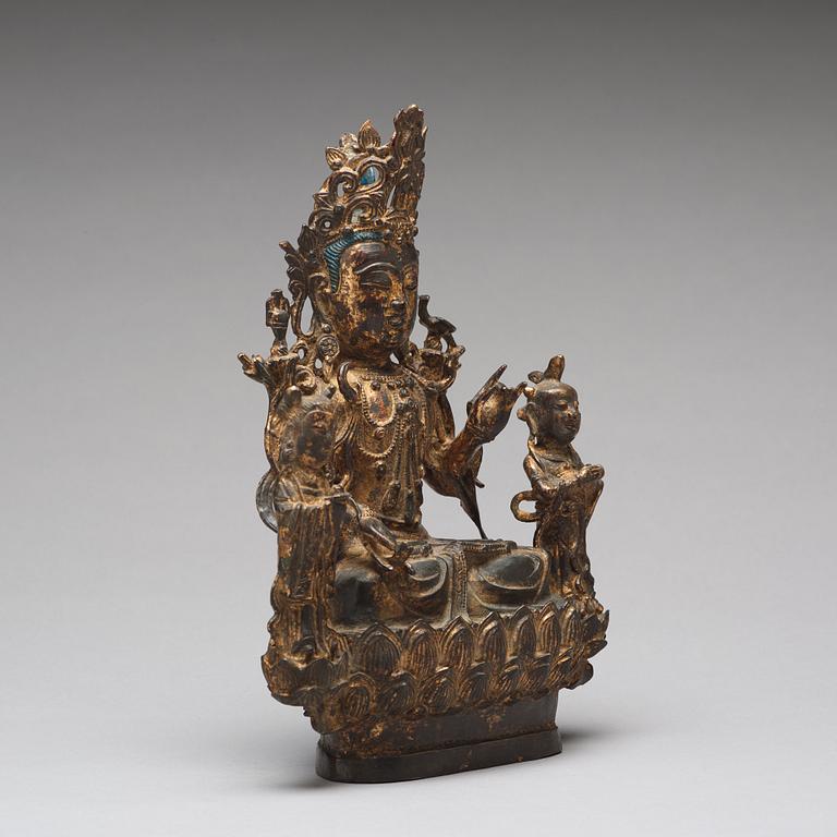 A bronze sculpture of boddhisattva and two attendants, Ming dynasty (1368-1644).