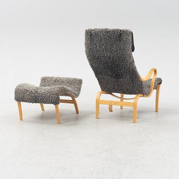 A 'Pernilla' easy chair with stool by Bruno Mathsson for Bruno Mathsson International, dated 2004.