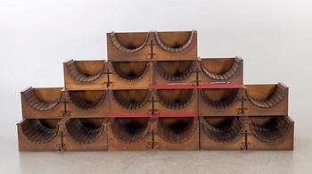 A set of nine loose wood wine racks from the turn of the century 1900/2000.
