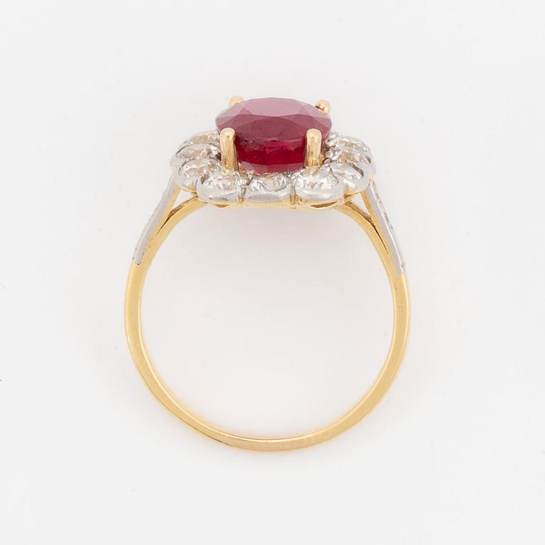 An 18K gold and platinum ring set with a faceted ruby weight ca 3.35 cts.