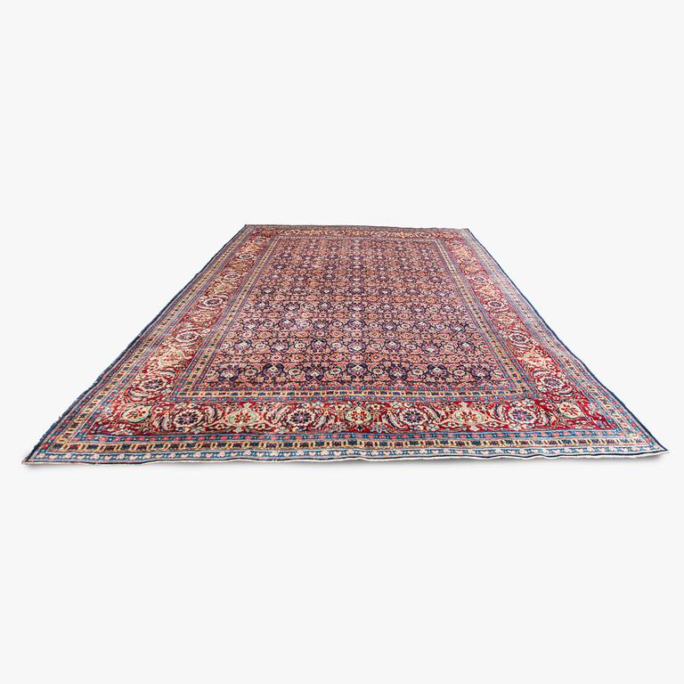 A carpet, a semi-antique Tabriz, ca 357 x 255 cm.