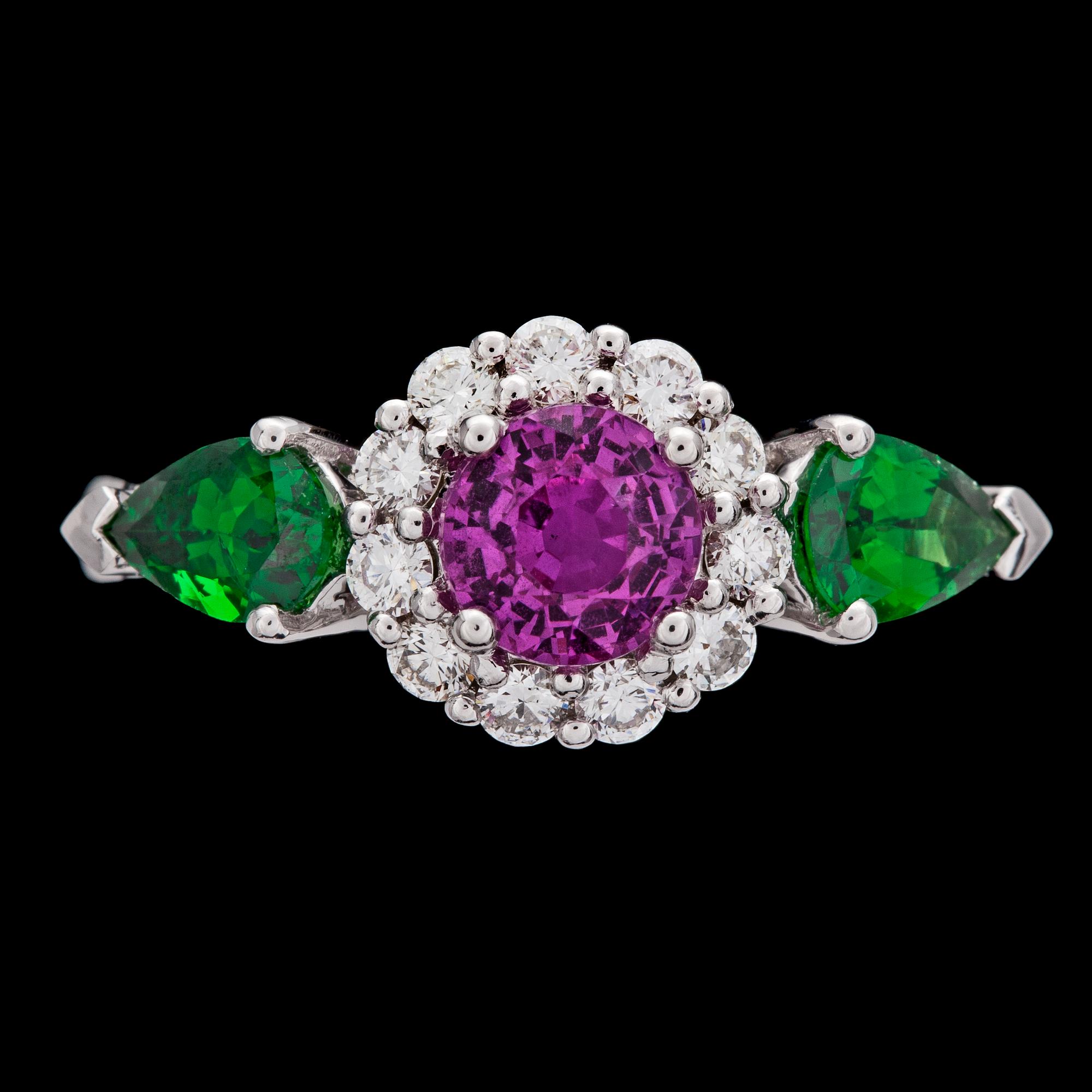 A pink sapphire, tsavorite and diamond ring.