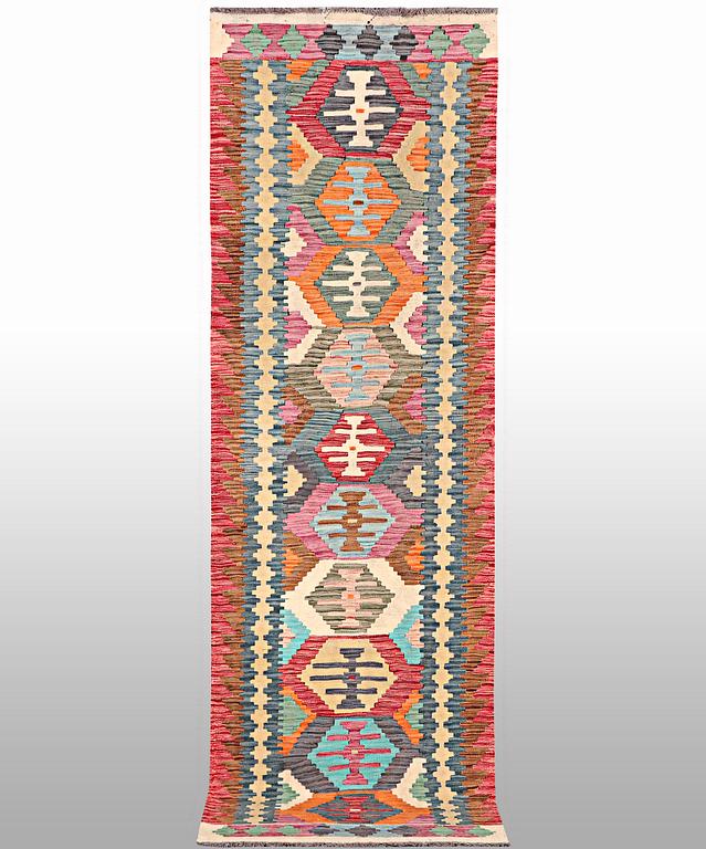 A Kilim runner, a. 294 x 82 cm.