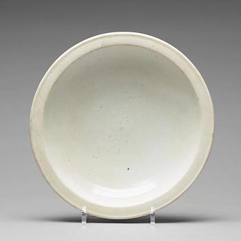 A light celadon glazed dish, Ming dynasty (1368-1644).