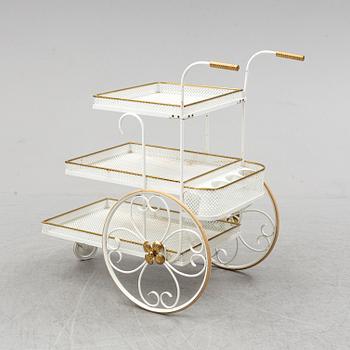 A white lacquered metal and brass serving trolley, 1940's-50's.