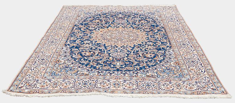 A carpet, Nain, part silk, ca. 295 x 201 cm.