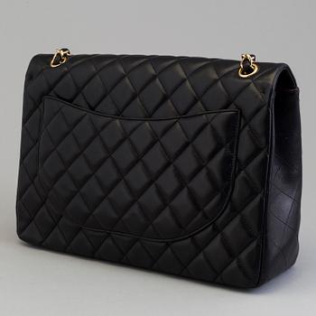 A "Double flap bag maxi" by Chanel 2009-10.