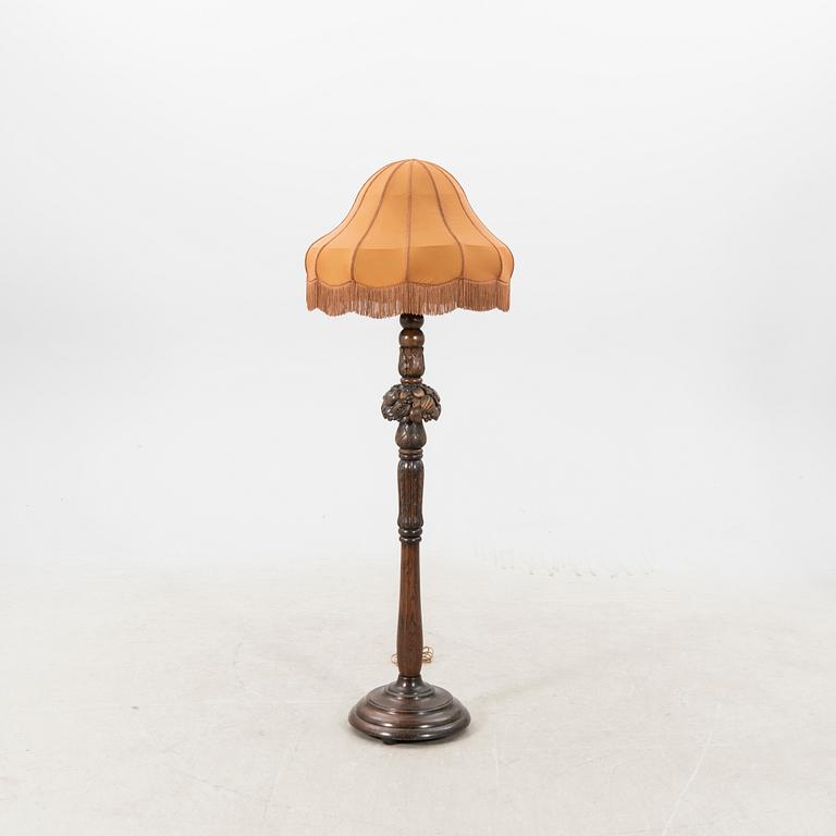 An early 1900s oak floor lamp.