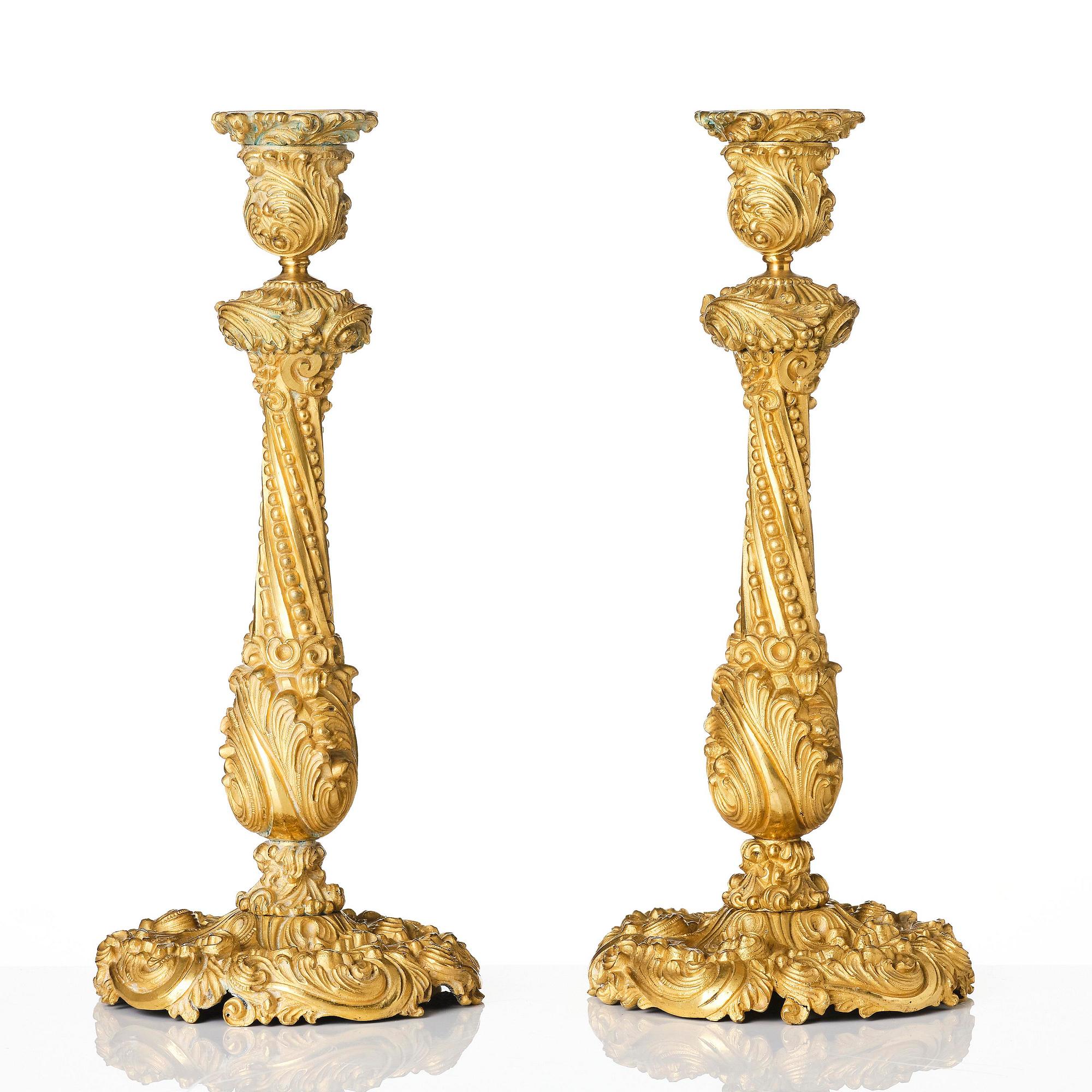 A pair of gilt-bronze rococo-revival candlesticks, later part 19th century.
