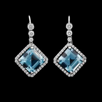 966. A pair of step cut aquamarine earrings set with brilliant cut diamonds.