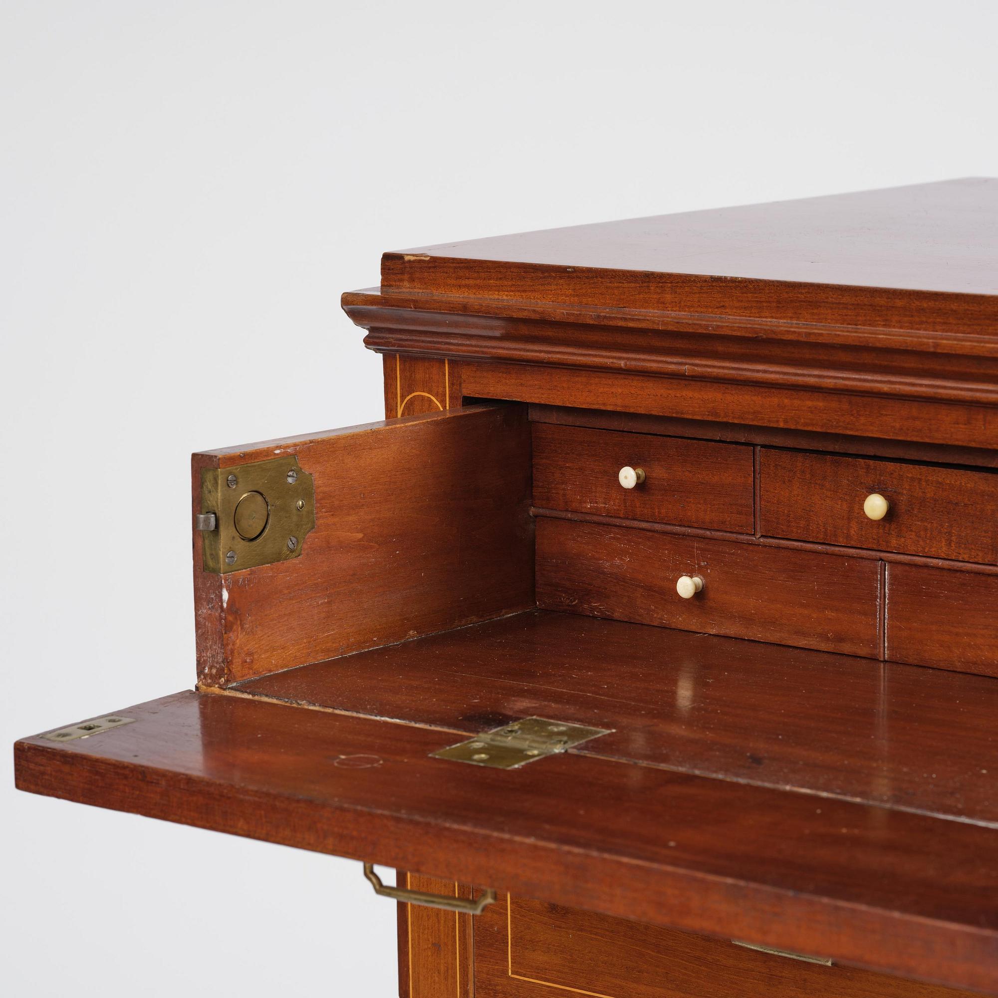 A late Gustavian mahogany writing commode in the manner of I. Löfgren, Stockholm circa 1800.