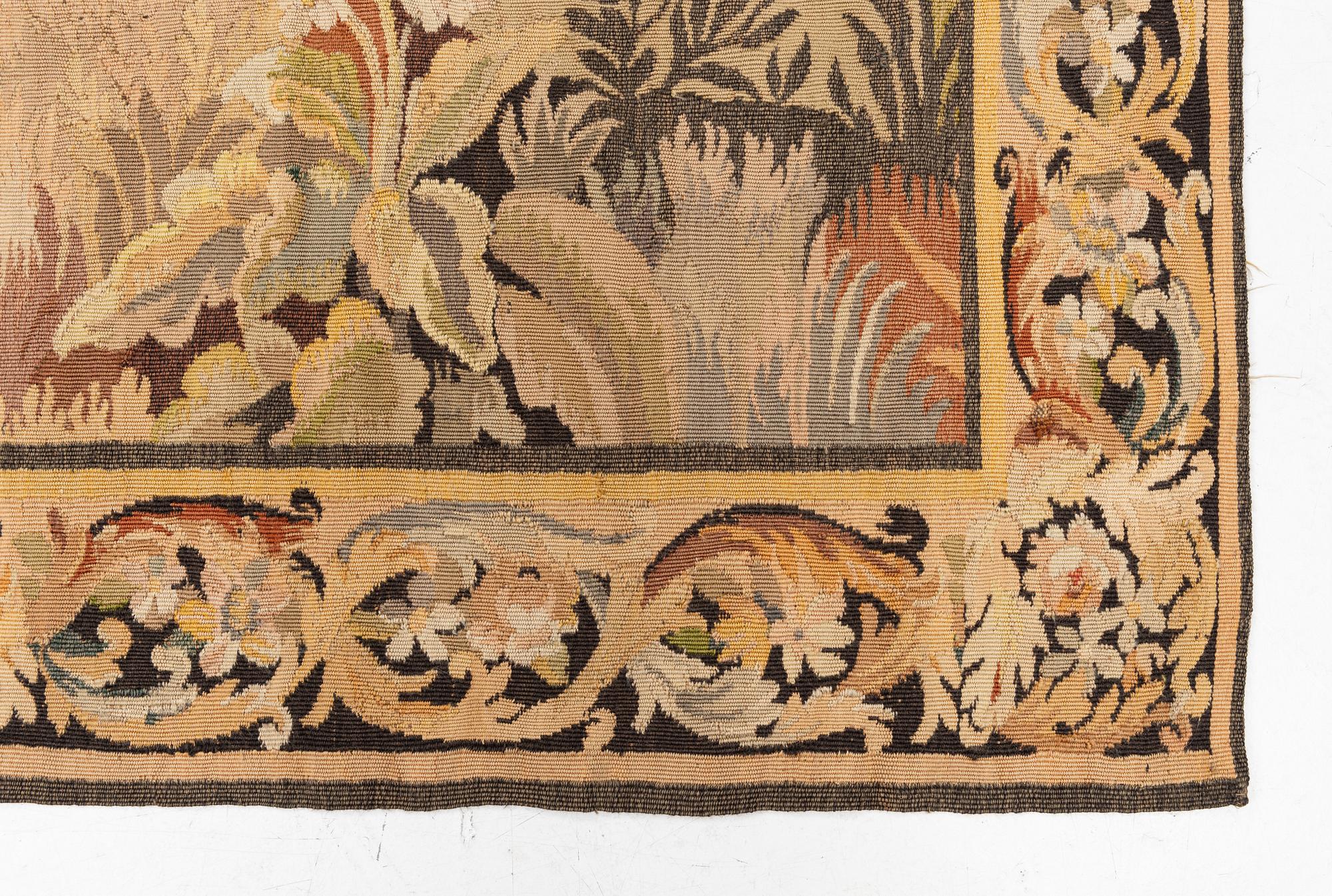 A European 'verdur' tapestry, c. 297 x 290 cm, 17th century.