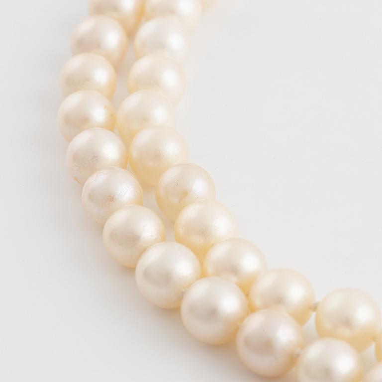 Two strand cultured pearl necklace, clasp 18K gold with half pearl and eight cut diamonds.