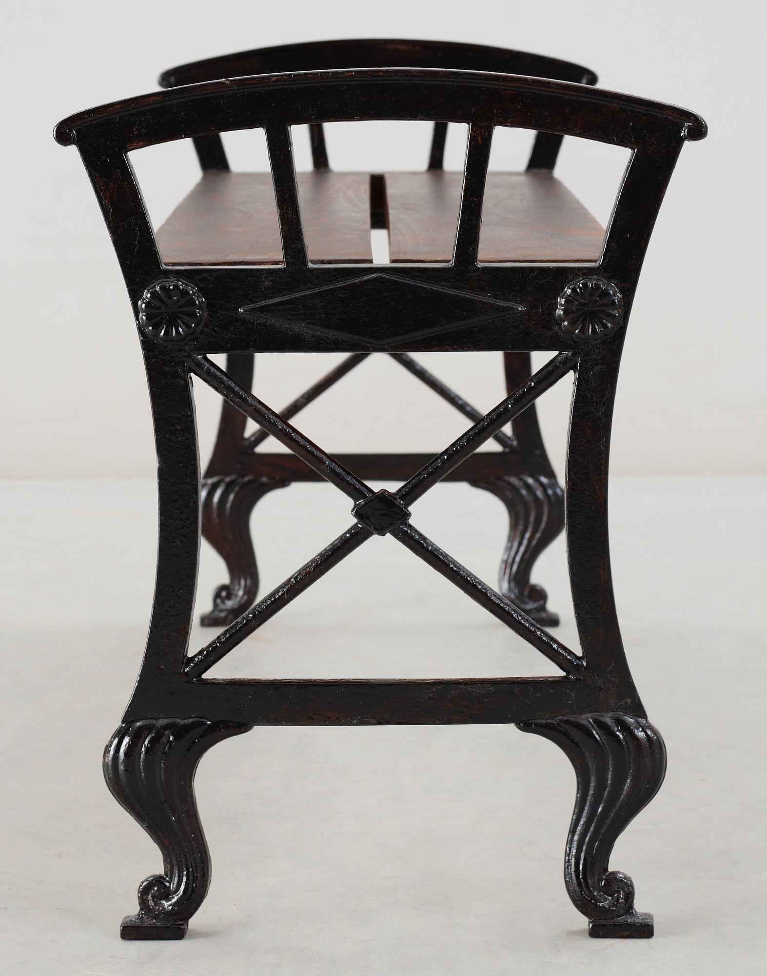 A Folke Bensow black lacquered cast iron and wood park bench, Näfveqvarns Bruk.