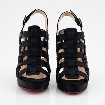 Christian Louboutin, a pair of black silk sandals, size 37 1/2.