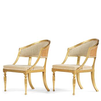 55. A pair of late Gustavian giltwood open-back armchairs, Stockholm, late 18th century.