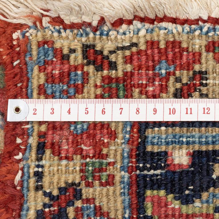 An Antique Heriz carpet, North west persia, c. 380 x 310 cm.