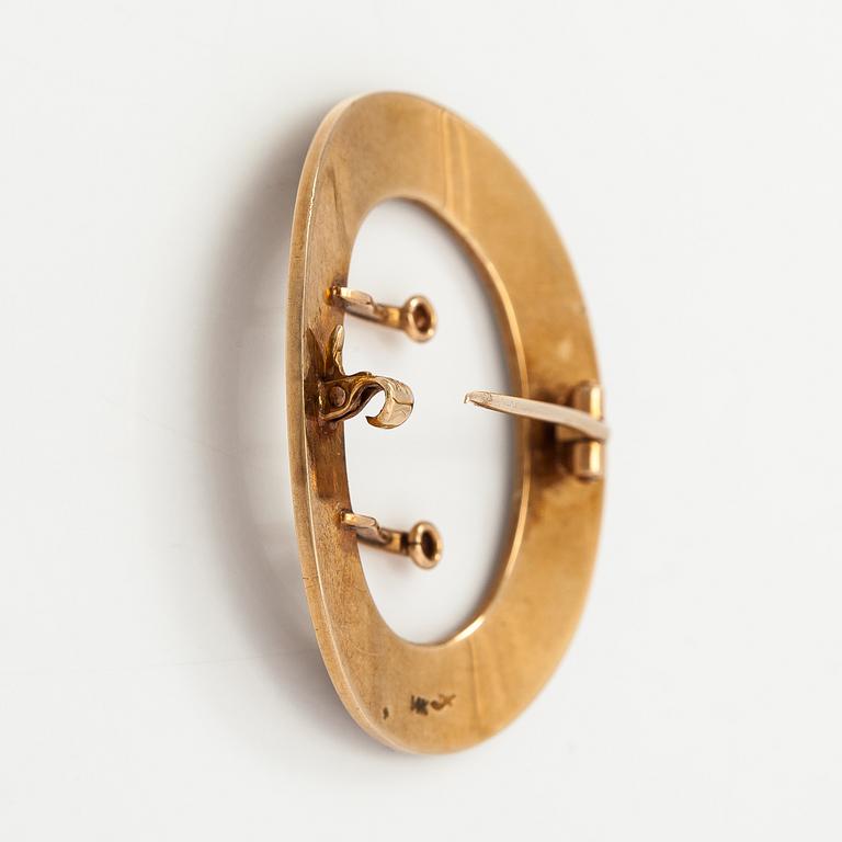 A 14K gold brooch with enamel and cultured pearls.