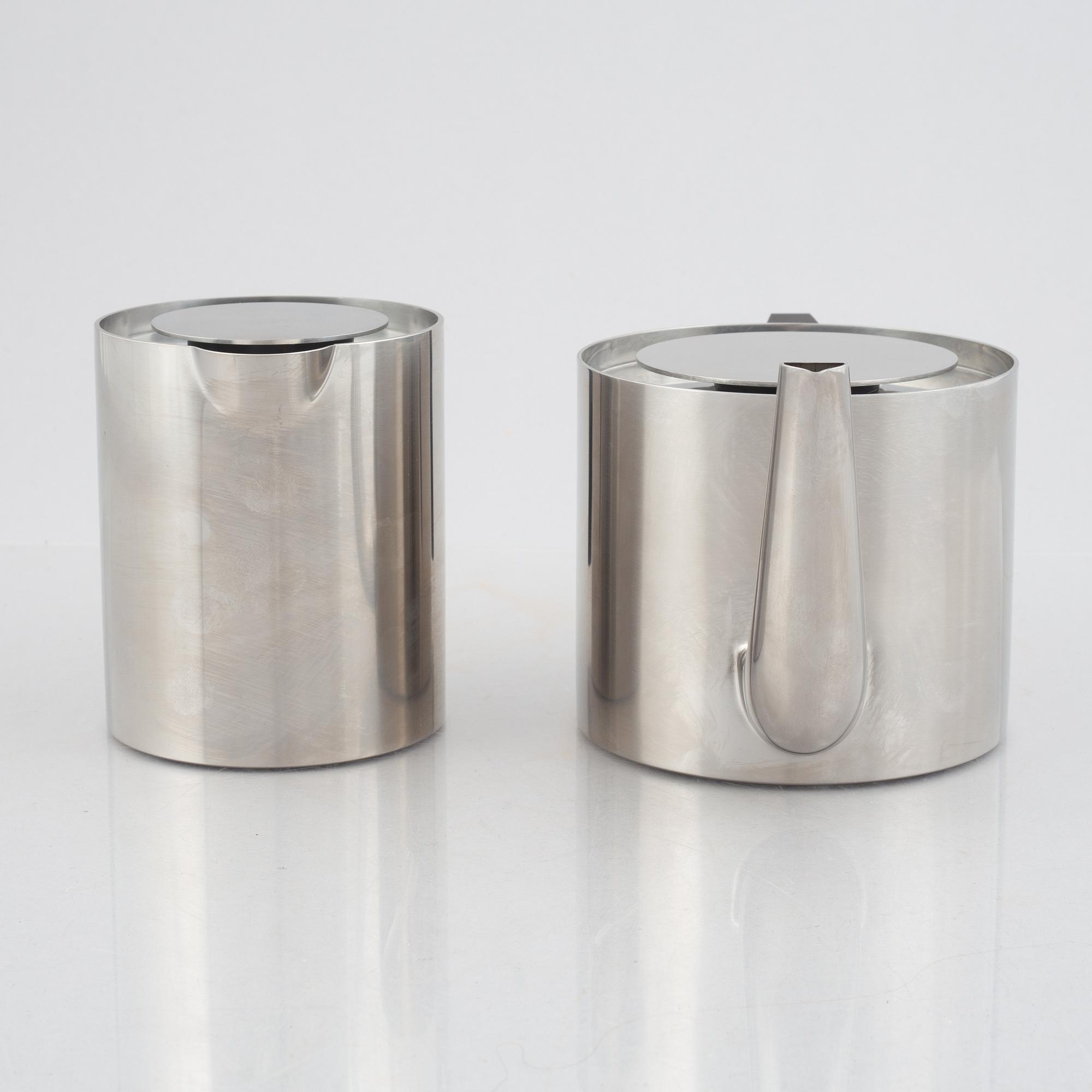 Arne Jacobsen, a 100-year jubilee "Cylinda" stainless steel tea set and a book, Stelton, Denmark, 2002.
