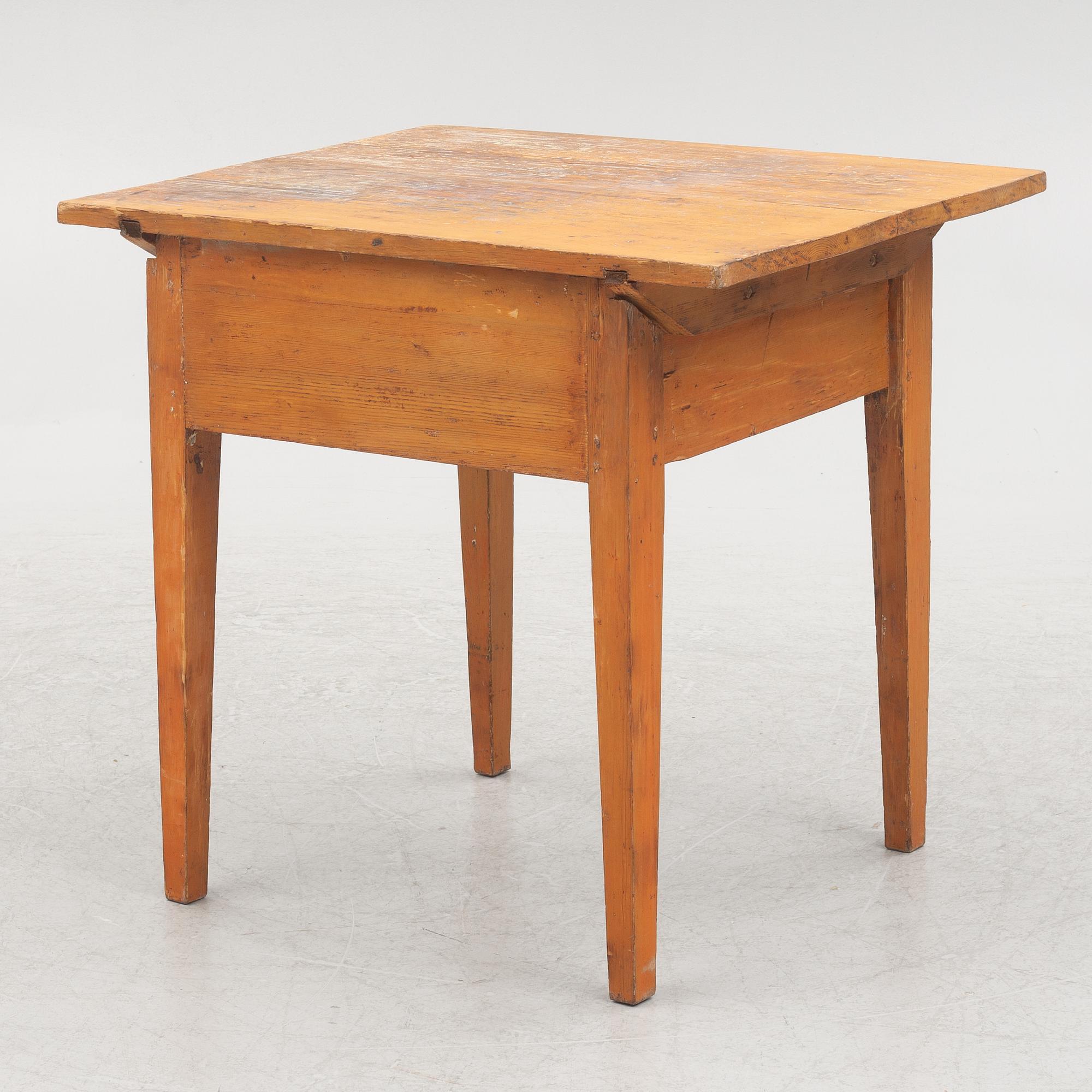 A table with drawer, 19th century.