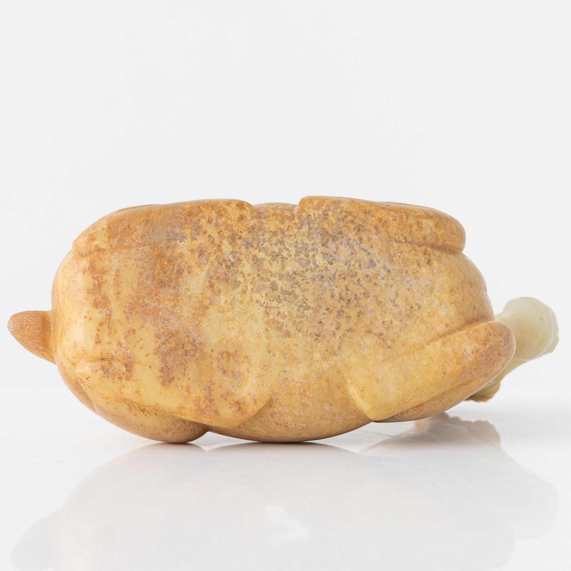 A carved nephrite figure of a reclining horse, 20th Century.